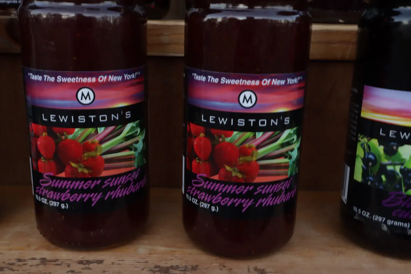 Jars of Summer Sunset Strawberry Rhubarb on a market shelf